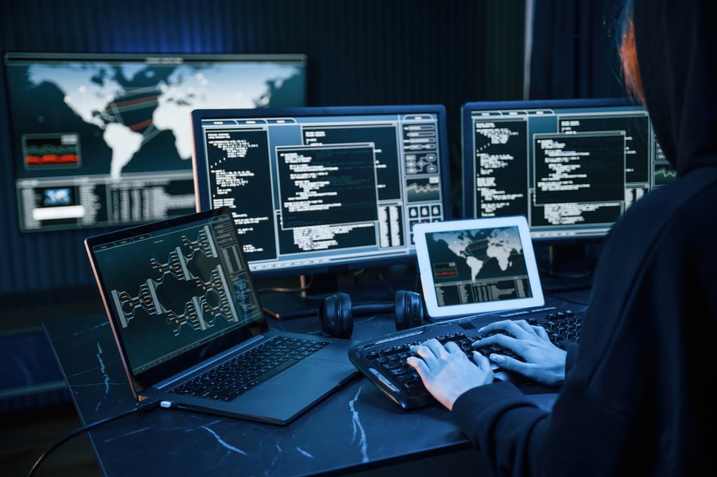 We See THIS Before a Security Issue, and Most Teams Miss It! 5 young professional female hacker is indoors by computer with lot information displays